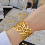 ⁦سوار (إسورة) "الشُعب المرجانية" الذهبي العريض⁩ - الصورة ⁦3⁩